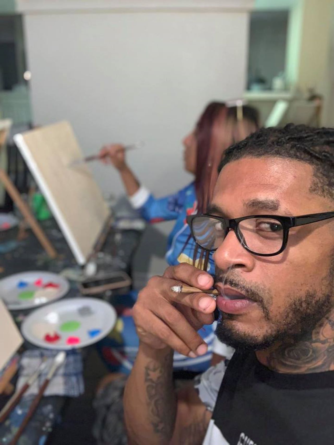 Man Smoking weed at a art class