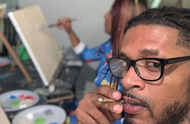 Man Smoking weed at a art class